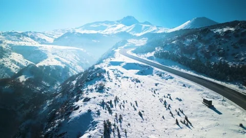 Snowy mountains roads pine forests and magnificent scenery 動画素材 294217621