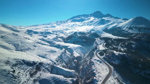 Snowy mountains roads pine forests and magnificent scenery 動画素材 294220373