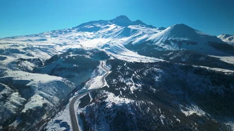 Snowy mountains roads pine forests and magnificent scenery 動画素材 294223083