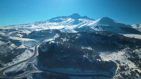 Snowy mountains roads pine forests and magnificent scenery 動画素材 294223890
