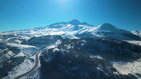 Snowy mountains roads pine forests and magnificent scenery 動画素材 294224038