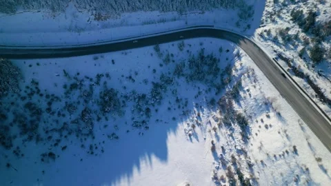 Snowy mountains roads pine forests and magnificent scenery 動画素材 294224787