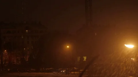 Snowy night in the light of the lanterns. Blizzard and heavy snowfall. Christmas Stock Footage 72790459
