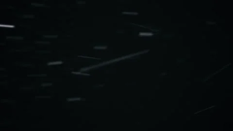 Snowy night. Snowflakes quickly fall down. Stock-Footage 144723791