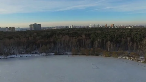 Snowy park in the megapolis. Air view of park Pokrovskoe-Streshnevo in Moscow Stock Footage 70541853