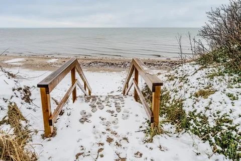 A snowy path to the beach in Dronningmlle Stock Photos