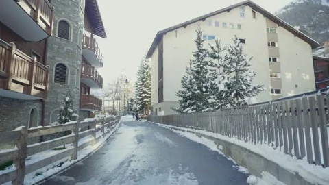 Snowy Pathway Between Buildings in a Winter Landscape Stock Footage 314616305