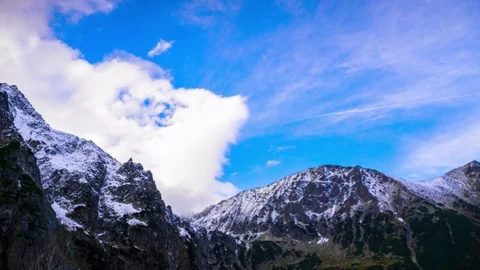 Snowy Peaks of Mountains with Clouds Stock Footage 69865070