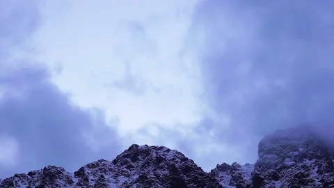 Snowy Peaks of Mountains with Clouds Stock Footage 84108092
