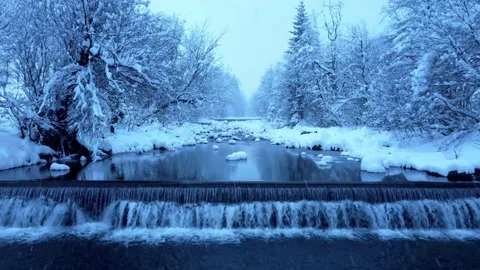 Snowy river landscape with cascading waterfall in cold winter scenery. Stock-Footage 341396815