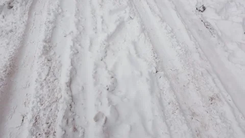 Snowy road after a blizzard with deep tire tracks.  Stock Footage 326135059