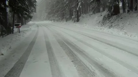 Snowy road flyover Stock Footage 11684593