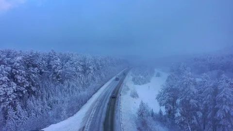 Snowy road in the middle of a forest on the Ural-Tau ridge Stock Footage 122928022