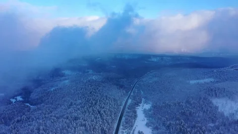 Snowy road in the middle of a forest on the Ural-Tau ridge Stock Footage 122929191