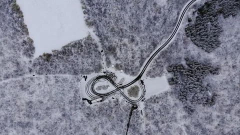 Snowy road in the shape of infinity Stock Photos