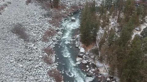 Snowy Rocks and River Rapids Flyover Stock Footage 105326035