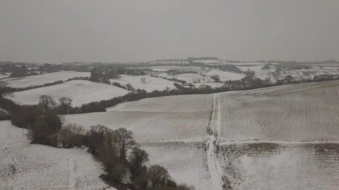 Snowy Scenes on this Moody Dark Devonshire Field by Drone Vídeo Stock 120250949