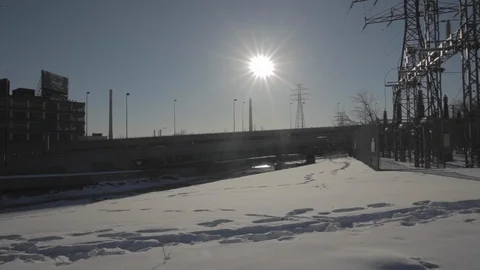 Snowy Setting with Industrial Backdrop Stock Footage 114021268