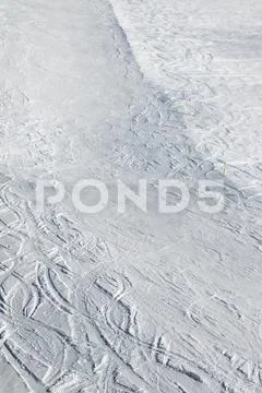 Snowy ski slope with trace from skis and snowboards Stock Photos