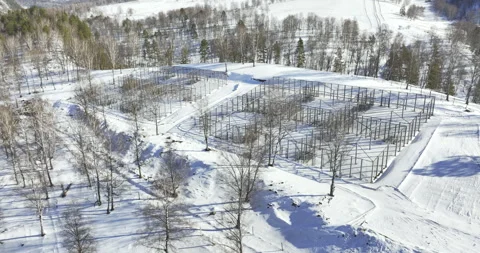 Snowy slope made of metallic framework looks industrial 動画素材 318742875