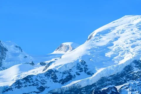 Snowy slopes of Grand Pilier dAngle in sunlight Stock Photos