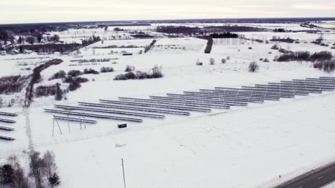 Snowy Solar Panel Array, Emphasizing Winter Sustainable Power Solutions Stock Footage 301622587