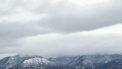 Snowy storm clouds motion over winter mountain timelapse,cold season weather Stock Footage 231545074