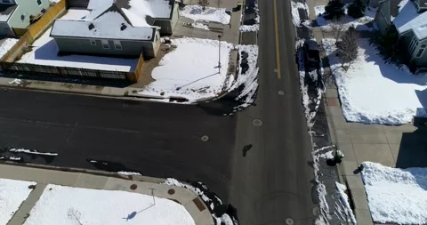 Snowy suburban threeway intersection and street. Stock Footage 150774162