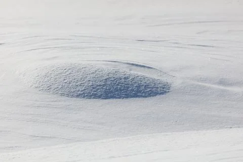 Snowy surface with a gentle, rounded depression Stock Photos