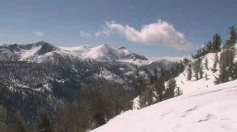 Snowy Time lapse clouds over the Rocky Mountains Stock Footage 531384
