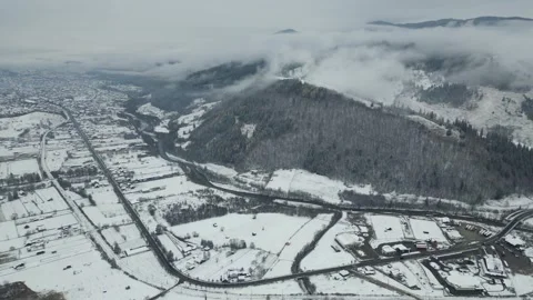 Snowy Town with a Mountain Backdrop Stock Footage 300508206