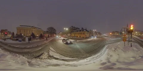 Snowy Traffic Intersection and Traffic Lights Central Stockholm Evening - 360 VR Stock Footage 103461234