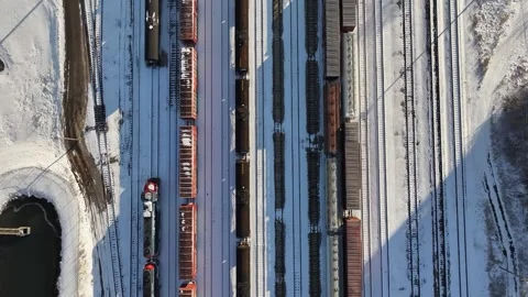 Snowy Train Tracks Railroad Yard Tilt to I-74 Highway Champaign, IL Stock Footage 273669319