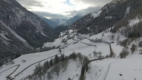 Snowy valley between mountains Stock Footage 79751678