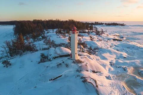 Snowy view of Povorotny lighthouse, Vikhrevoi island, Gulf of Finland, Vybo.. Stock Photos