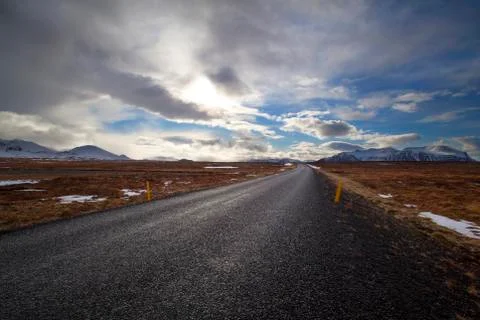 Snowy volcano landscape with dramatic clouds in Iceland Stock Photos