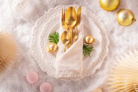 Snowy white table setup with lovely ornaments. Stock Photos