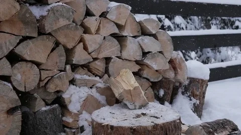 Snowy winter day slowmotion two hits with axe Stockbeeldmateriaal 84625433