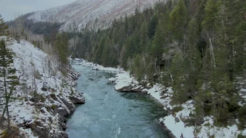 Snowy Winter Flathead River Drone - Hungry Horse, Montana Stock Footage 164170956