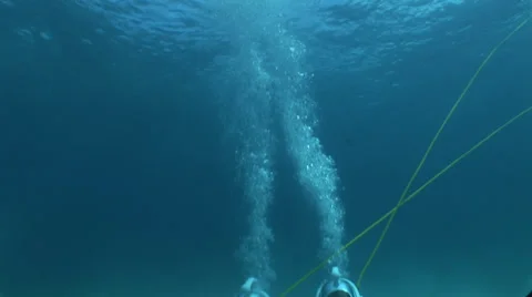 Snuba Divers on Knees with Bubbles Stock Footage 36370668