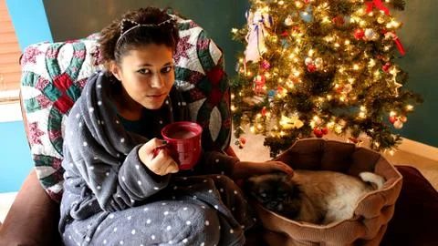 Snuggling by the Christmas Tree Stock Photos