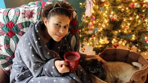 Snuggling by the Christmas Tree Stock Photos