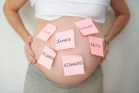 So many names to choose from. an unidentifiable pregnant woman with adhesi... Stock Photos