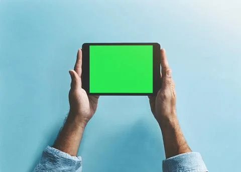 So small but it does so much. Studio shot of a man holding a digital tablet with Stock Photos