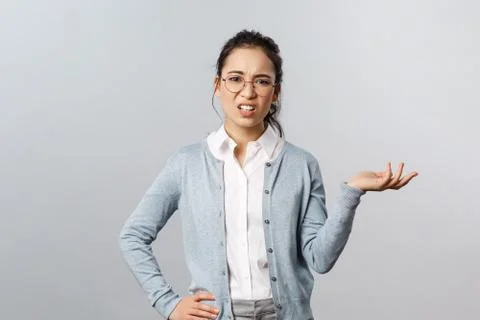 So what. Skeptical arrogant asian woman, looking with dismay and judgement Stock Photos