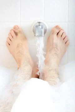 Soaking in the bathtub. Stock Photos