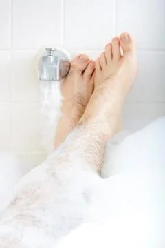 Soaking in the bathtub. Stock Photos