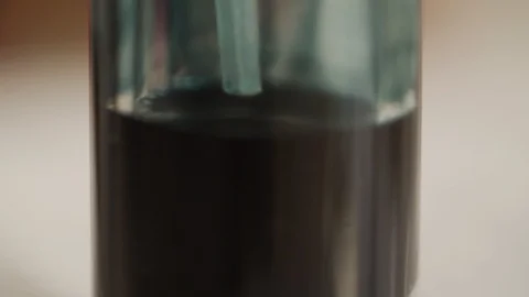 Soaking Up Black Liquid from Bottle Vidéo 111757251