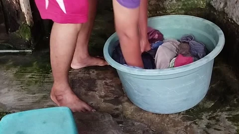 Soaking dirty laundry Stock Footage 218217006