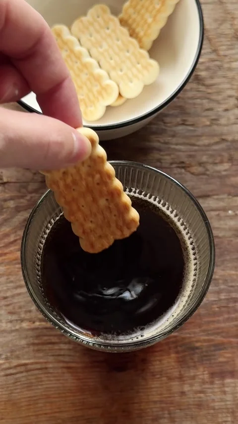 Soaking dry biscuits in coffee for tiramisu in yogurt Stock Footage 328017803